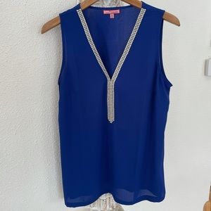 Top with pearls and a deep blue color.